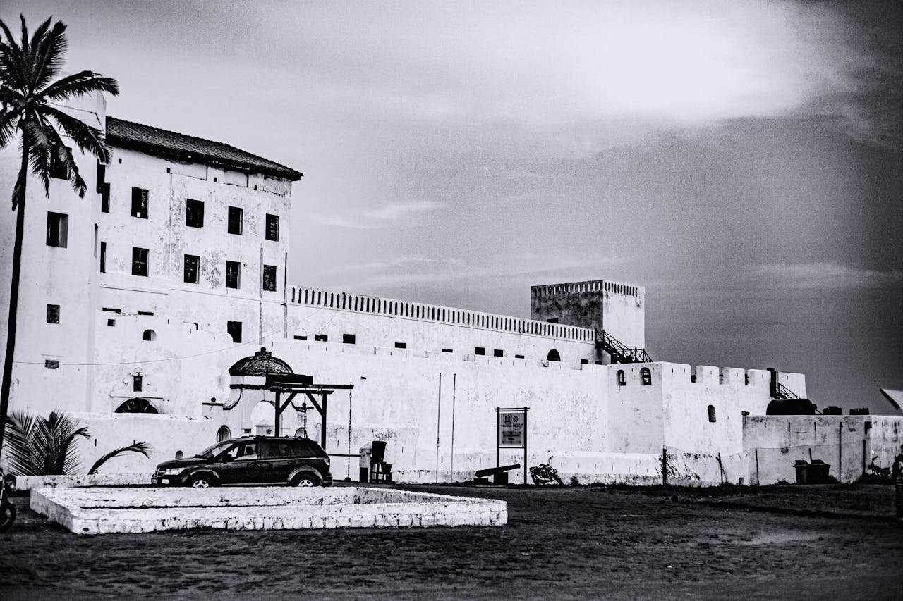 Mastering the First Impression: Your intriguing post title goes here A black and white view of Cape Coast Castle in Ghana, highlighting its historic architecture.